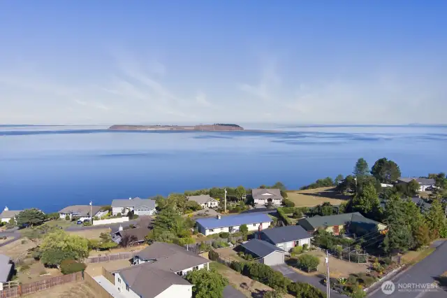 Aerial view with this home in the front left, gives you a sense of the neighborhood and expansive views.  Just minutes to downtown, this area is a Port Townsend treasure.