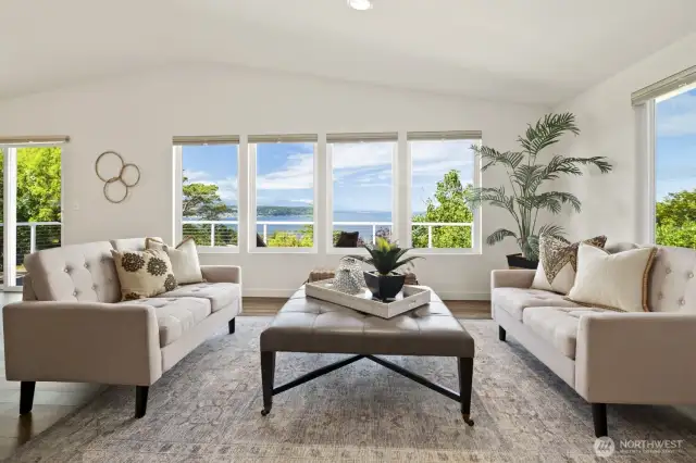 To spend the day lounging in front of this view, with the fireplace nearby....  And on a warmer day, step right outside to the lovely deck and take in the fresh air and beauty.  Watch the ships, scenic mountains, and Protection Island from this perch.  This home is easy to love.