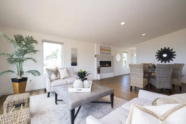 Another angle of the great room: the windows to the water view are on the left from this perspective - here you see the propane fireplace and the front door on the right, just past the fireplace and window.