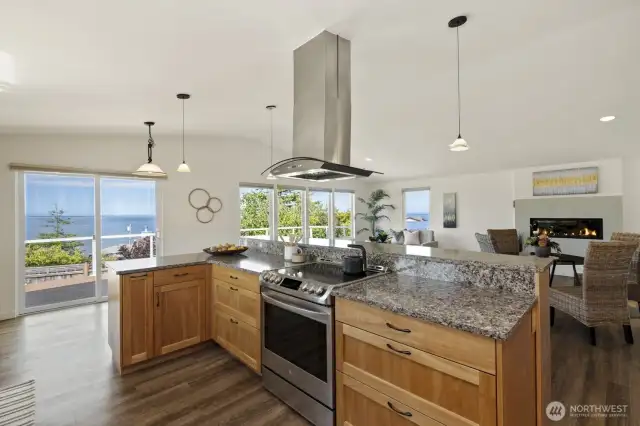 The seller preferred electric range for indoor cooking, however the house has been plumbed with a propane line direct to kitchen range area, if you prefer to switch out.  What a great house for enjoying your guests, the fireplace and the view while cooking!