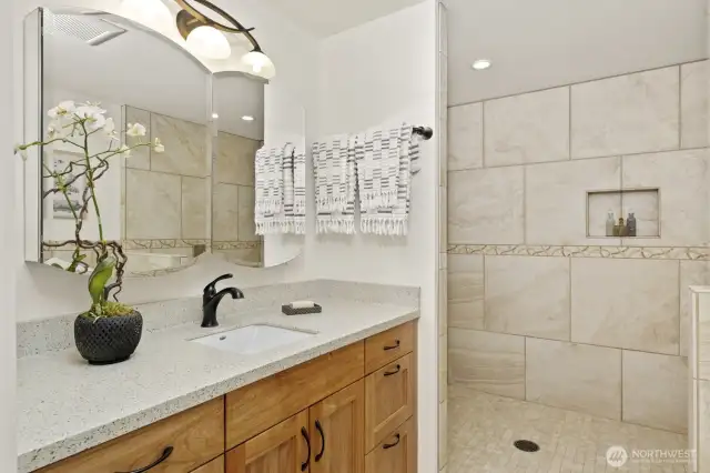 This outstanding bathroom serves the first bedroom and bonus room on the north side of the home, and is also just a few steps away from the great room.  Wait until you see it!