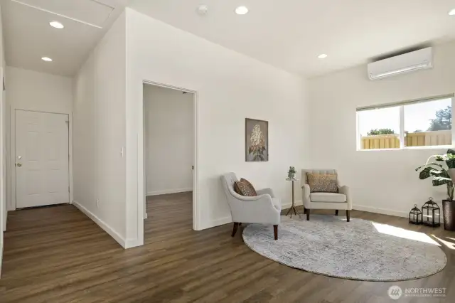 Three steps down to the second bonus room, which is directly adjacent to the second bedroom, on the south side of the house