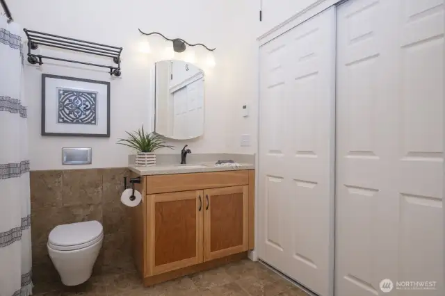 The second full bath on the south side of the house has a full closet for storage!