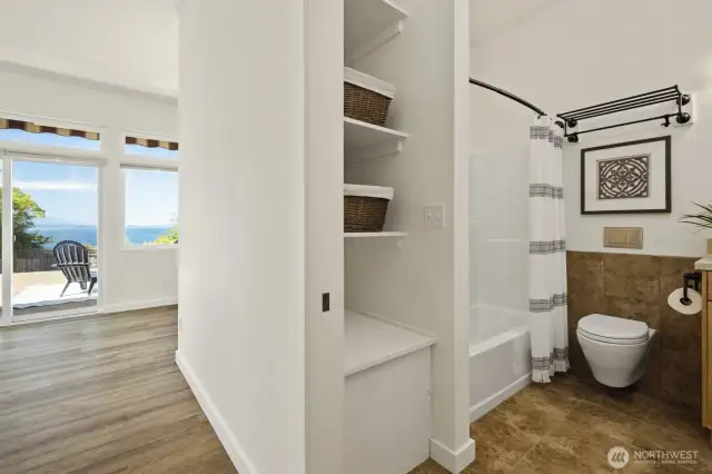 Second bathroom on the right, showing hallway to the second bonus room and second bedroom - all in a separate wing of the house.