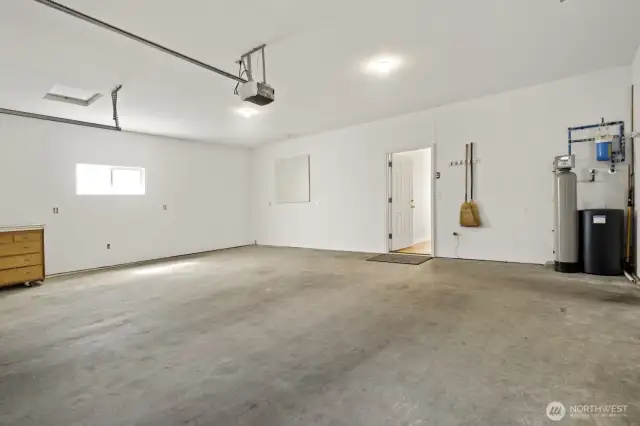 Off the south side hallway, you find a large two car garage, with room for tools and toys.