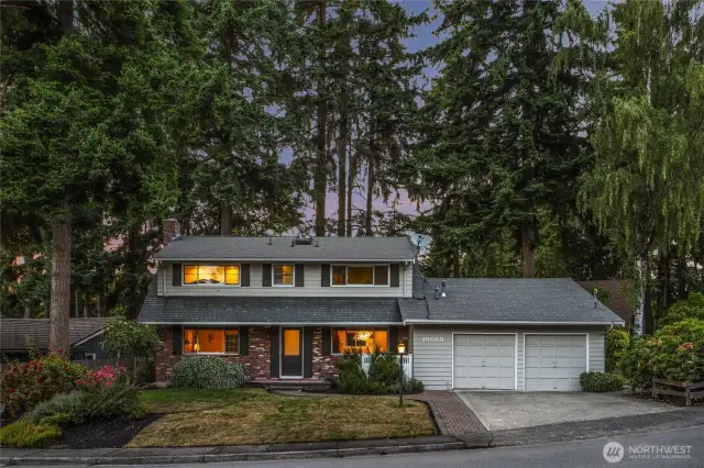This mid-century home with stunning curb appeal is quietly tucked within the Evergreen trees.