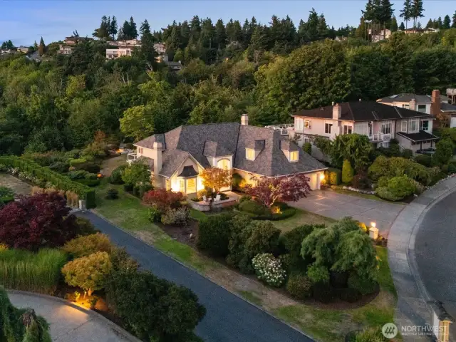 Twilight Photo Shows Exterior Lighting on and Around the Home