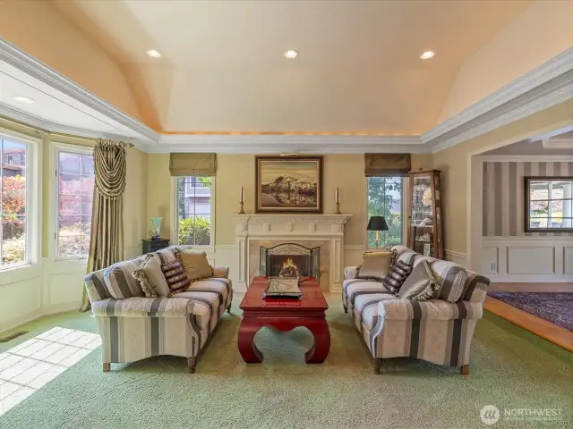 Formal Living Room with Gas Fireplace, Vaulted Ceiling and Custom Lighting