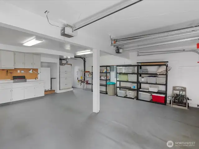 3 Car Garage with Built-in Cabinets and Work Space