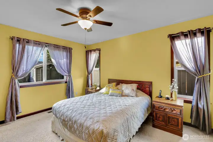 Another view highlights the spacious primary bedroom, offering comfort, style, and plenty of room to relax.