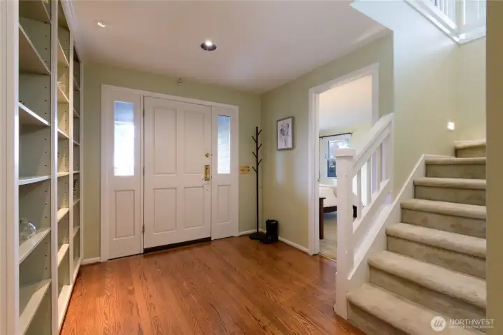 Front entry way, with book cases and hall closet