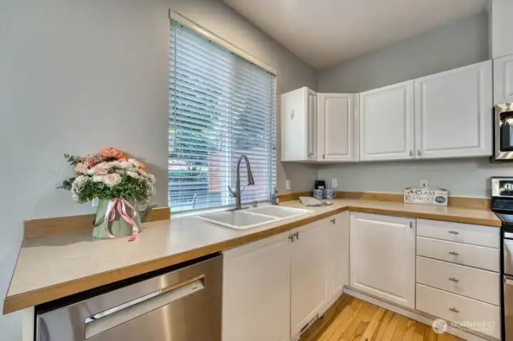 Another view of the kitchen with large window - great for passing through meals inside/outside.