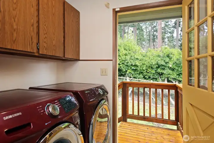 laundry upstairs with steps down to back yard