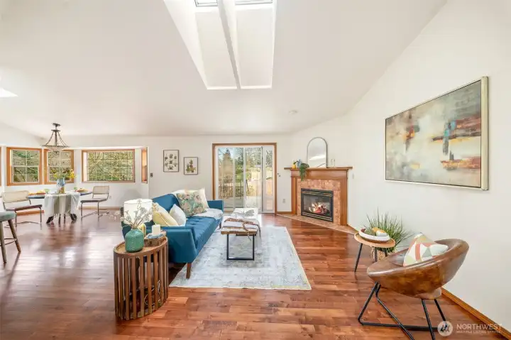 As you walk through the front door, you are greeted with natural maple hardwood floors, wood wrapped windows and tons of natural light