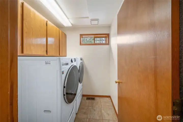 The newer washer and dryer in the laundry room stay!