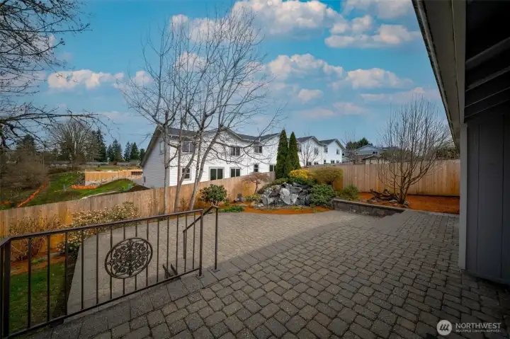 New fence around entire backyard installed in 2025; two level paver patio and custom designed 3 level water feature installed in 2007.