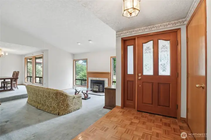 Interior entryway, front door and living room, parkay flooring.