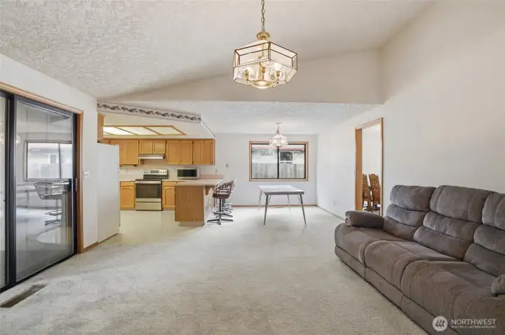 View of kitchen and dining area from family room