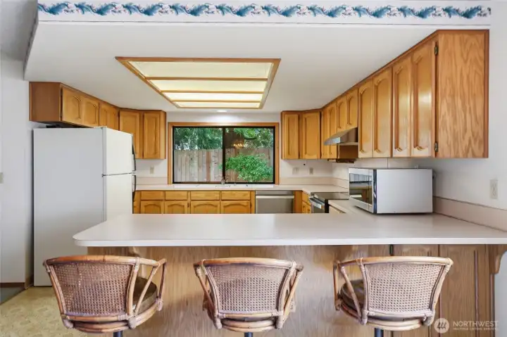 View into kitchen from eat bar