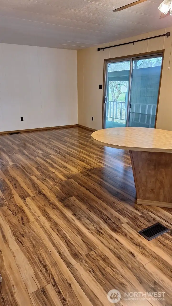 This is the view from the kitchen toward the family room. The large wall would be great for that big screen entertainment center.