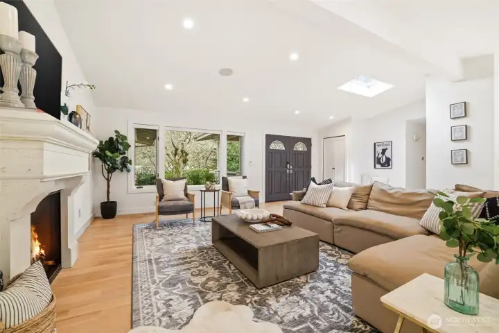 Cozy gathering space with fireplace and natural light throughout