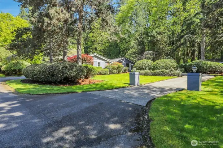 Tucked back from the road, privacy and mature landscaping waiting for you!