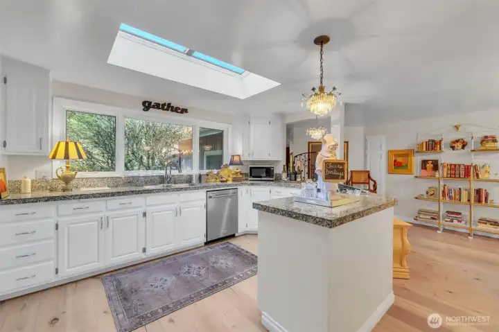 Large eat-in kitchen with pantry and ample cabinetry.