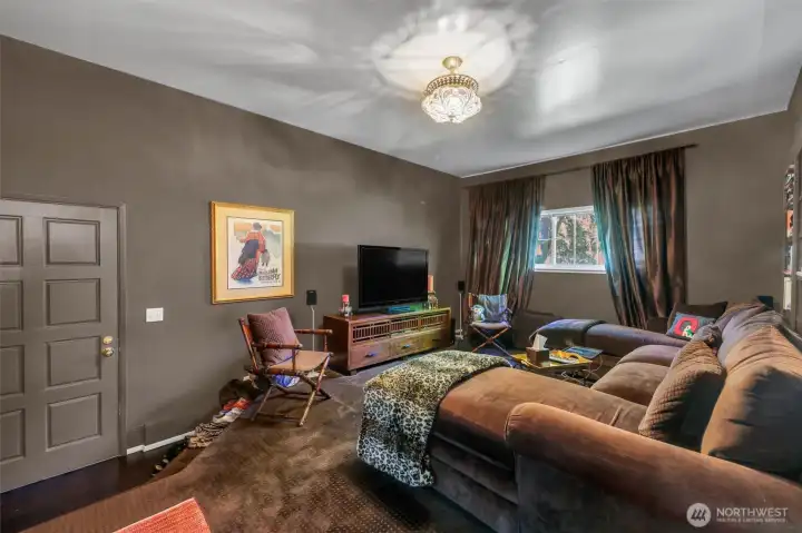 Media room with blackout curtains for movie nights and premiere gaming, so many uses for this room off the kitchen