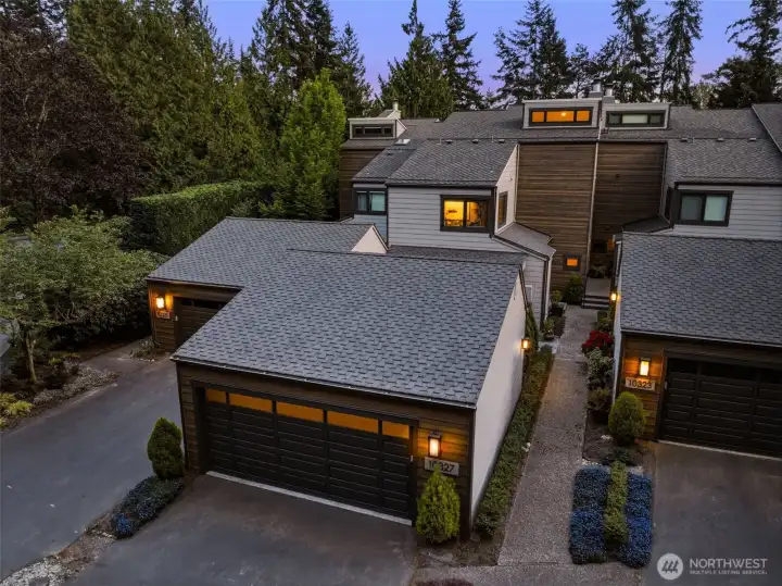 The pristine two-car garage is enhanced with epoxy floors & custom built-in storage.