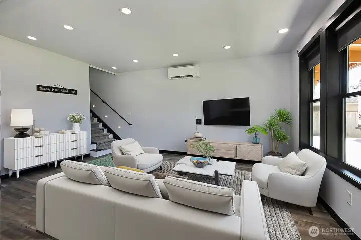 Living Room. A Door closes off the staircase for privacy upstairs Living Room. A Door closes off the staircase for privacy upstairs