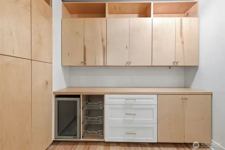 Amazing walk in pantry with beverage fridge.