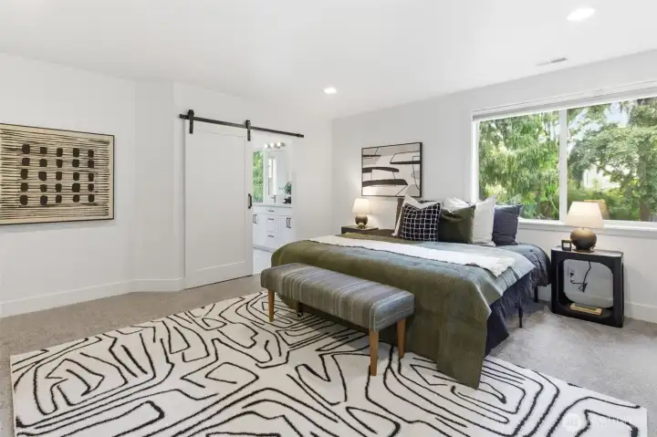 Primary upstairs with en suite bath and walk in closet.