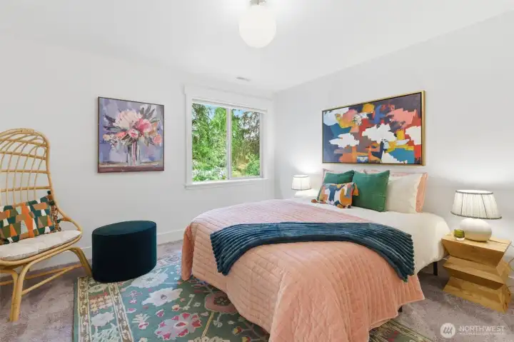 Second bedroom on upper floor with walk in closet.