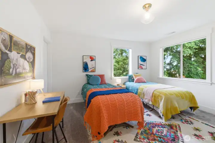 Third bedroom on upper floor with walk in closet.