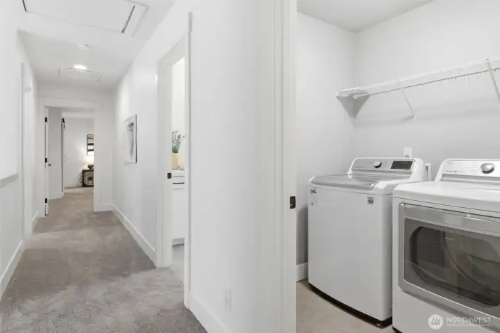 Upper floor hallway with laundry room.