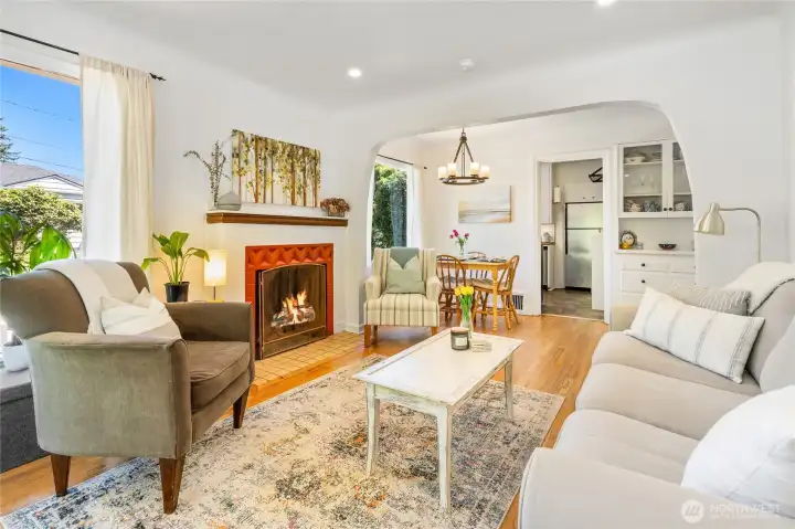 Living room with archway leading to the dining room.