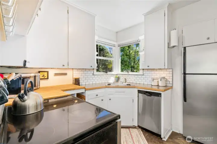 Stainless steel kitchen with plenty of cabinet storage.