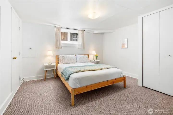 Lower level bedroom used as a guest bedroom.