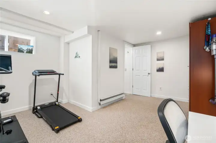 Another shot of one of the lower bedrooms showing door leading to 3/4 bath.