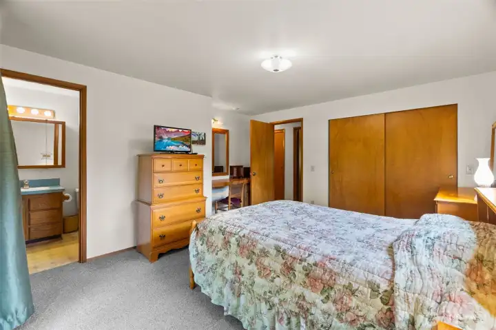 Primary bedroom with 3/4 bath and vanity area Primary bedroom with 3/4 bath and vanity area