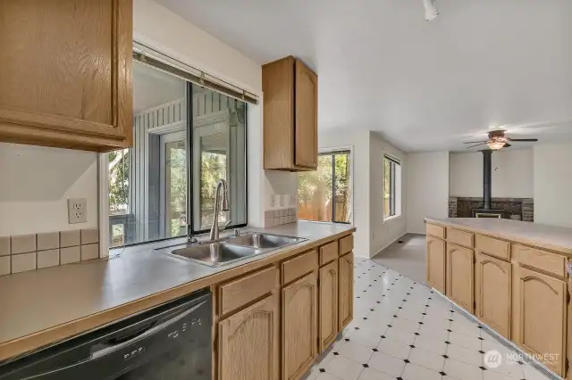 The kitchen is a cook's delight with an abundance of cabinetry and stainless appliances.
