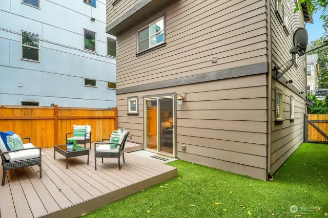 Pet-friendly, luxury turf makes living easy in this fenced-in back yard.