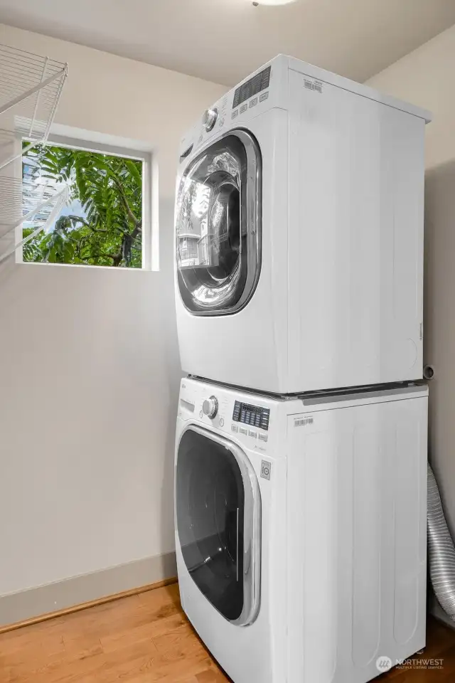 A walk-in pantry with laundry is just off the kitchen to the left of the fridge.