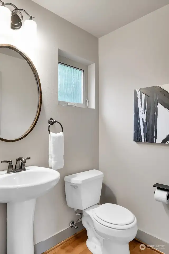 Guests get their own half bath on this thoughtfully laid-out main floor.