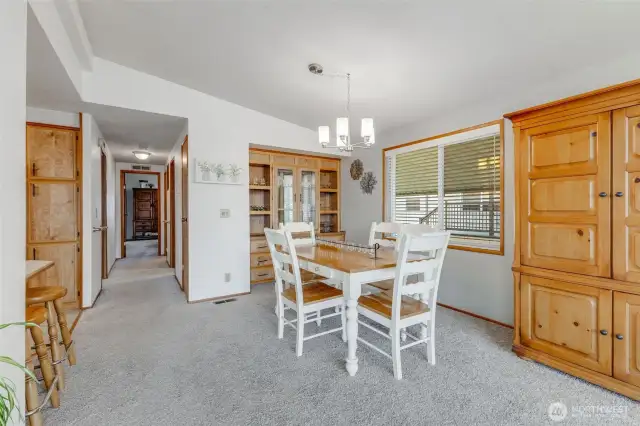 Dining area with built in china hutch with lighting, display shelving & storage