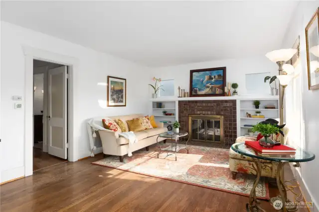 Living room with original tile surrounding fireplace