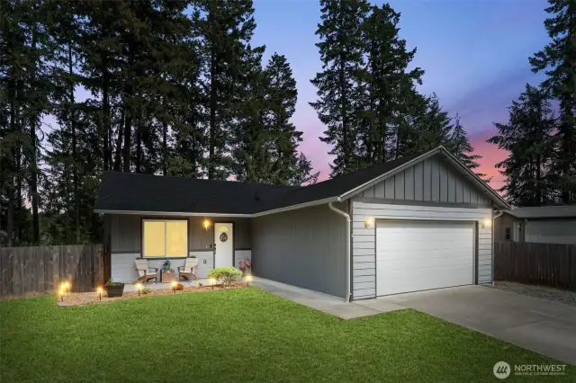 Photo enhanced twilight and grass.  Front patio of this well kept gem.