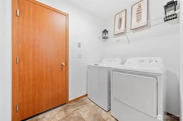 Right across from the bathroom is your utility room with brand new washer and dryer, leading into your garage space.