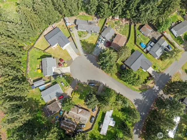 Center home, slightly to the right. shows how much yard space you have on this impeccable rambler.