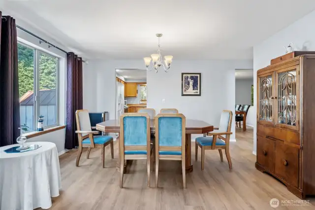 Formal dining room with large window and easy access to the kitchen.
